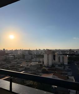 a view of a city at sunset from a building at 818 - Standard Premium in Uberlândia