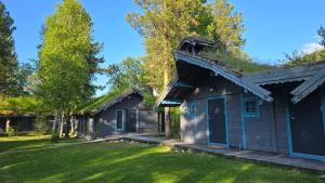 a house with a turf roof and a yard at ONGA Boutique Lodge in Alta +43 photos