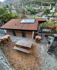 a house with a solar panel on top of it at NEW Larioview suites in Argegno +25 photos