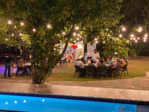 a group of people sitting at tables at an event at River Tree Bolgoda in Panadura +219 photos
