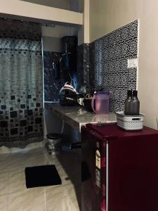 a kitchen with a counter and a counter top at Oak & olive stays in Tezpur