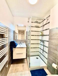 a bathroom with a shower and a sink at BoHémian Studio in Sète Center in Sète