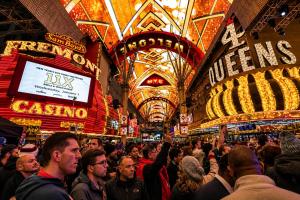 a crowd of people standing in a market with lights at Collection O Las Vegas in Las Vegas