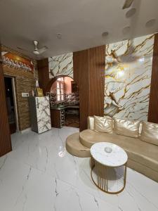 a living room with a couch and a table at Home stays in Jammu