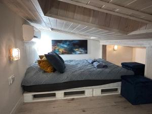 a room with a bed in a loft bed at RAJSKIE REZYDENCJE-Antresola Czarna,Antresola Biała in Bilcza