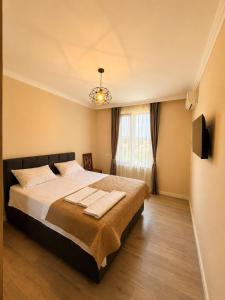 a bedroom with a bed with two towels on it at phranta in Gonio +45 photos