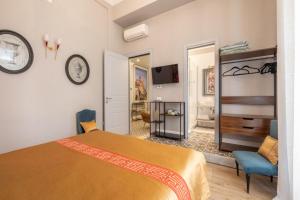 a bedroom with a bed and a clock on the wall at Guest House 73 in Cagliari
