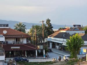 a group of buildings in a town with a street at Aurora Apartments Stavros in Stavros