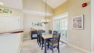 a kitchen and dining room with a table and chairs at Bear Trap Dunes - 45D Willow Oak Ave in Ocean View +48 photos