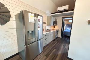 a kitchen with a large stainless steel refrigerator at Red Barn South - 41 in Mead