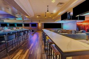 a bar with tables and chairs in a restaurant at Collection O Las Vegas in Las Vegas