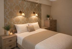 a bedroom with a bed with two night stands and two lights at Evergreen Residence VárLak in Debrecen
