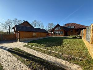a house with a yard in front of it at Violetta Cottage in Užice