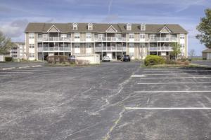 a parking lot in front of a large building at 30399 Pavilion Dr, #1301, Ocean View in Ocean View