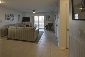 a living room with two couches and a television at 30399 Pavilion Dr, #1301, Ocean View in Ocean View
