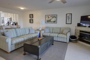 a living room with two couches and a coffee table at 30399 Pavilion Dr, #1301, Ocean View in Ocean View