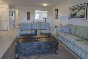 a living room with two couches and a coffee table at 30399 Pavilion Dr, #1301, Ocean View in Ocean View +40 photos