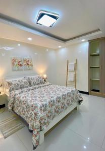 a bedroom with a large bed in a room at La case Dytobi Mermoz in Dakar