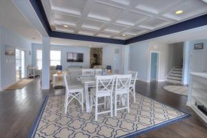 a dining room with a white table and chairs at 36967 S. Silver Sands Dr, Bethany Beach in Bethany Beach