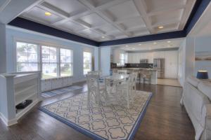 a living room with a table and chairs and a kitchen at 36967 S. Silver Sands Dr, Bethany Beach in Bethany Beach