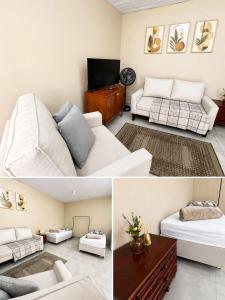 a living room with a white couch and a table at Vila Chacrinha apartamento 2 in Campo Limpo