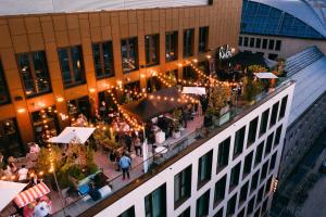 an overhead view of a building with a crowd of people at Ruby Louise Hotel Frankfurt by IHG in Frankfurt