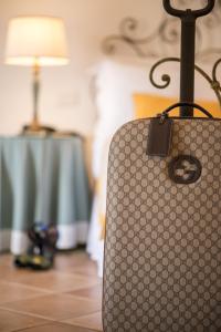 a suitcase sitting on the floor in a room at Hotel Caesar Augustus in Anacapri