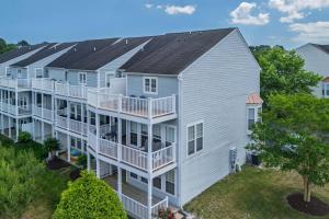 an aerial view of a large apartment building with balconies at 11 Mooring La in Millville