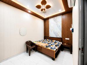 a room with a bed and a chair in it at Maa janki paying guest house near Ram mandir in Ayodhya +26 photos