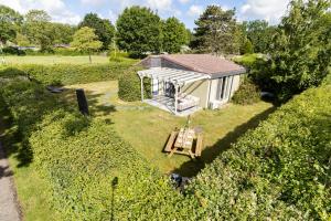 an aerial view of a tiny house in a field at Vrijstaande bungalow met grote privé tuin dichtbij Veerse meer in Kortgene