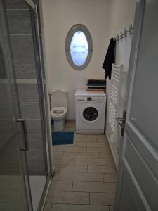 a small bathroom with a toilet and a window at BELLE MAISON A Ménars in Menars +45 photos
