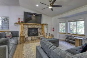 a living room with a couch and a fireplace at Tahoe Forest Haven in South Lake Tahoe