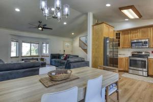 a kitchen and living room with a table and chairs at Tahoe Forest Haven in South Lake Tahoe