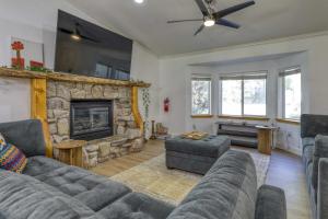 a living room with a couch and a fireplace at Tahoe Forest Haven in South Lake Tahoe