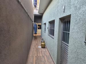 an alley with a fire hydrant sitting between two buildings at loft 2 em Salto Acomoda até 4 pessoas rede urbana in Salto