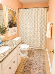 a bathroom with a toilet and a shower at luxury condo, pet friendly, close to everything in Augusta +11 photos