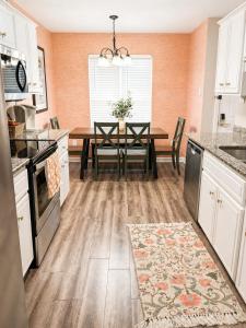 a kitchen with a table and a dining room at luxury condo, pet friendly, close to everything in Augusta