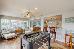 a living room with a ping pong table at Dog-Friendly Lakefront Home with Private Sundeck in Kingsland