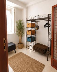 a room with a bunk bed and a plant at Casa do Criativo ® Bed&Breakfast in Almada
