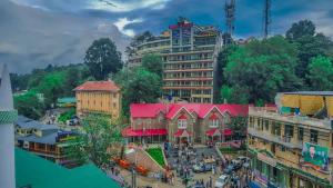 an overhead view of a city with buildings at Nice Guest House GPO Murree in Murree +9 photos