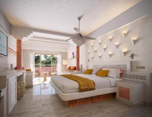 a bedroom with a large white bed with a ceiling at Iberostar Waves Quetzal - All Inclusive in Playa del Carmen +38 photos