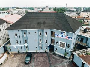 an aerial view of a building in a city at Muster Point Hotel & Suites in Port Harcourt