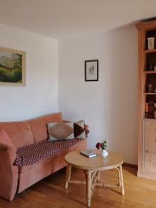 a living room with a couch and a coffee table at Gschwingerhof in Riedering