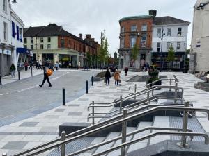 a group of people walking down a city street at Stonehaven B&B in Ennis