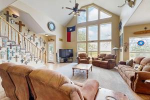 a large living room with couches and a tv at Waterfront Home with Kayak, View, Fire Pit & WiFi - Dog-Friendly in Buchanan Dam