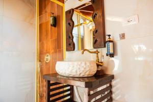 a bathroom with a sink and a mirror at Sokak Boutique Hotel in Berat +97 photos