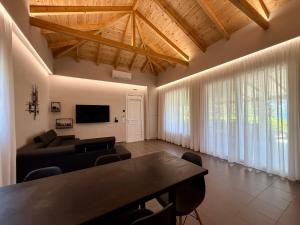 a living room with a table and a couch at S&S Home in Petalidi