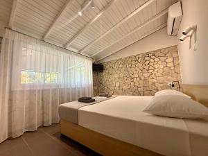 a bedroom with a large bed and a window at S&S Home in Petalidi