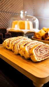 two slices of bread on a wooden cutting board at Nura Pousada in Maragogi