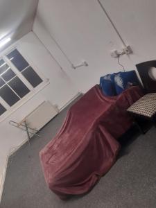 a room with a bed with a blanket on it at Vincente's in Chatham +2 photos